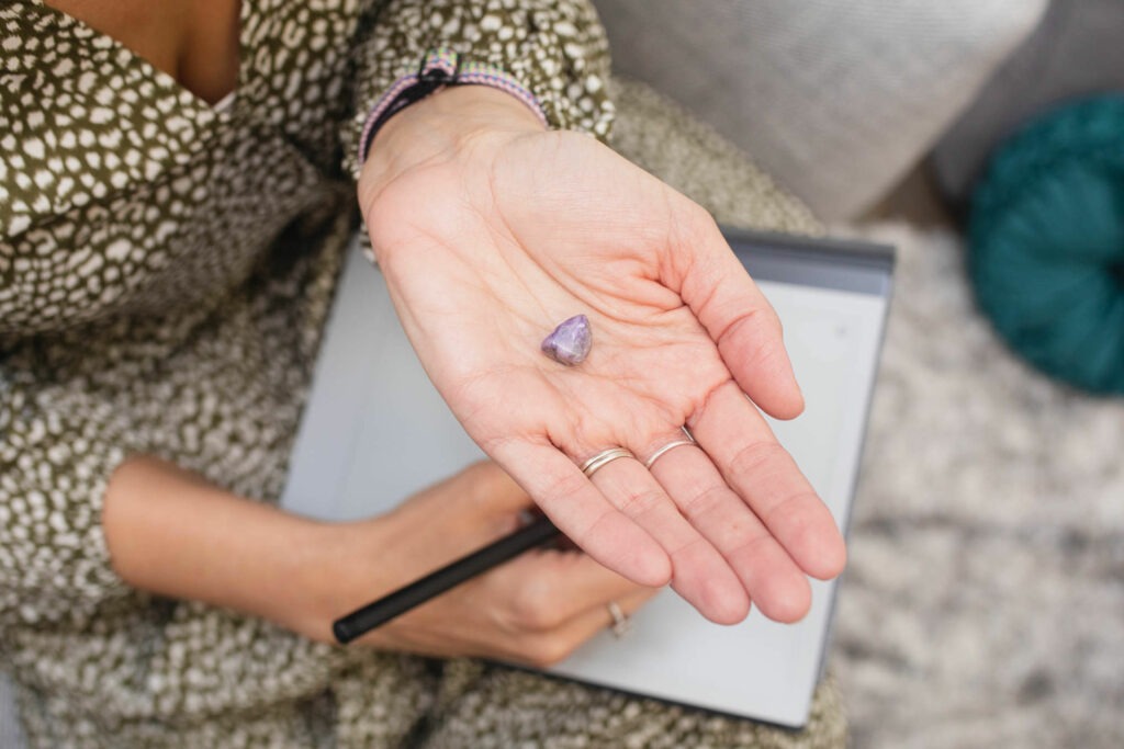 hand holding purple rock