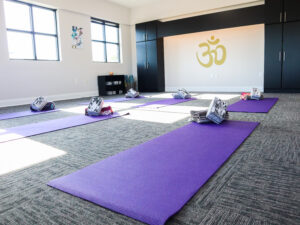 Purple yoga mat in the Evoke Wellness yoga studio, Wilmington, NC